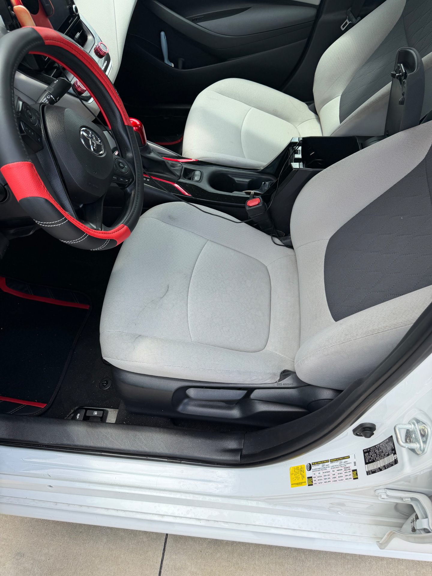 Cleaned white cloth front seats and refreshed interior details